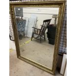 A large gilt decorated wall mirror,