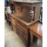 A 20th century oak court cupboard together with a tea trolley, two chairs,