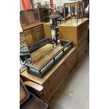 A Meredew light oak dressing table with matching tallboy and stool and an oak fire fender