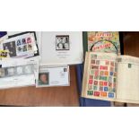 A stamp album, containing a penny red and other world stamps together with other stamps,