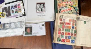 A stamp album, containing a penny red and other world stamps together with other stamps,