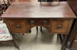 A 19th century mahogany sideboard with three drawers on turned legs