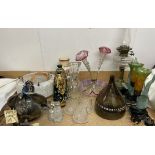 An oil lamp with a clear glass reservoir together with an epergne, table lamps, ceiling lamp,