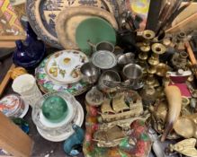 Glass dumpy weights together with brass candlesticks, other brasswares, pottery plates,