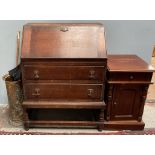 A 20th century oak bureau together with a brass umbrella stand, parasol,