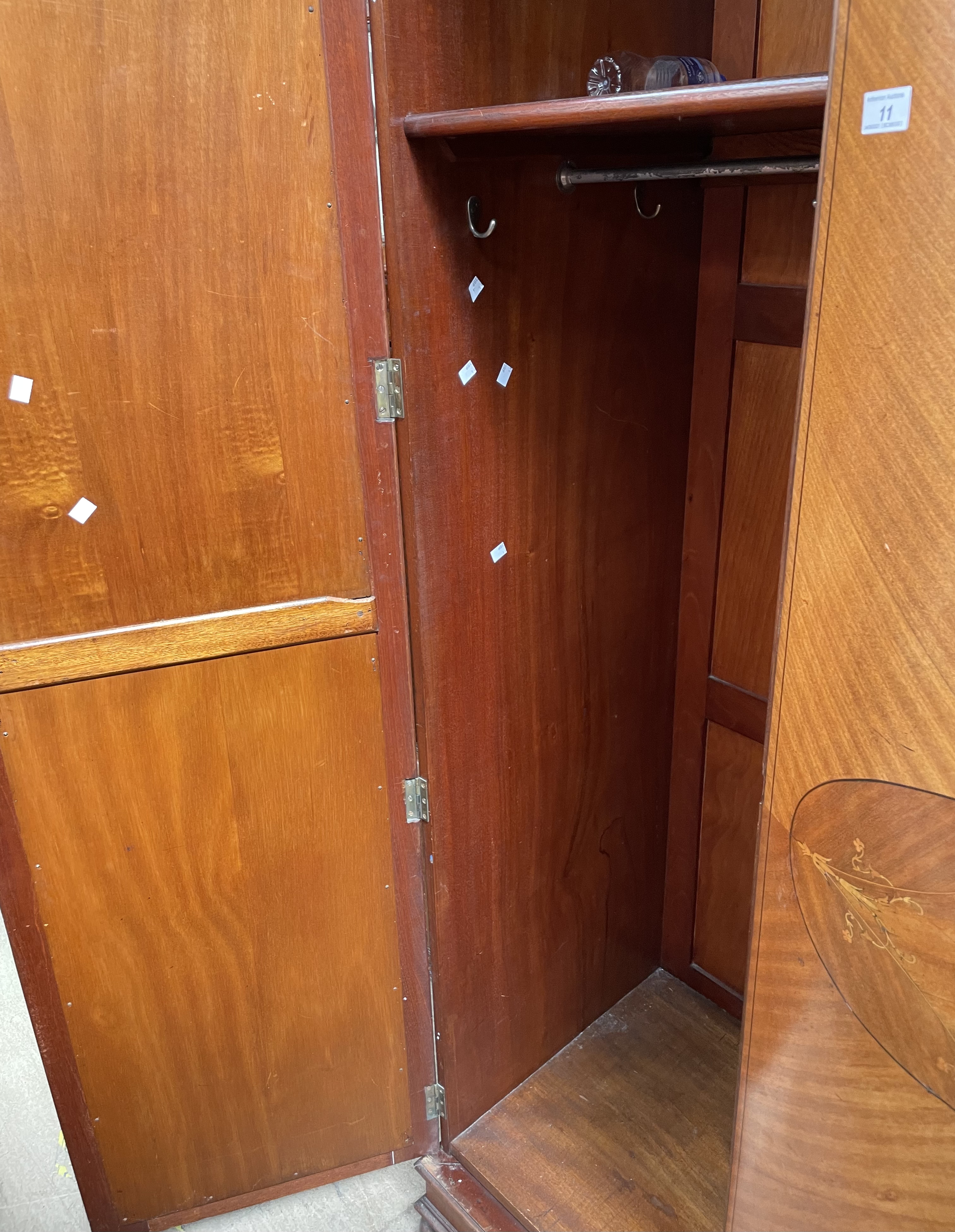 An Edwardian mahogany wardrobe, the moulded cornice above two mirrored doors on ball feet, - Image 3 of 4