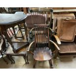 An Ercol stick back elbow rocking chair together with another elbow rocking chair,