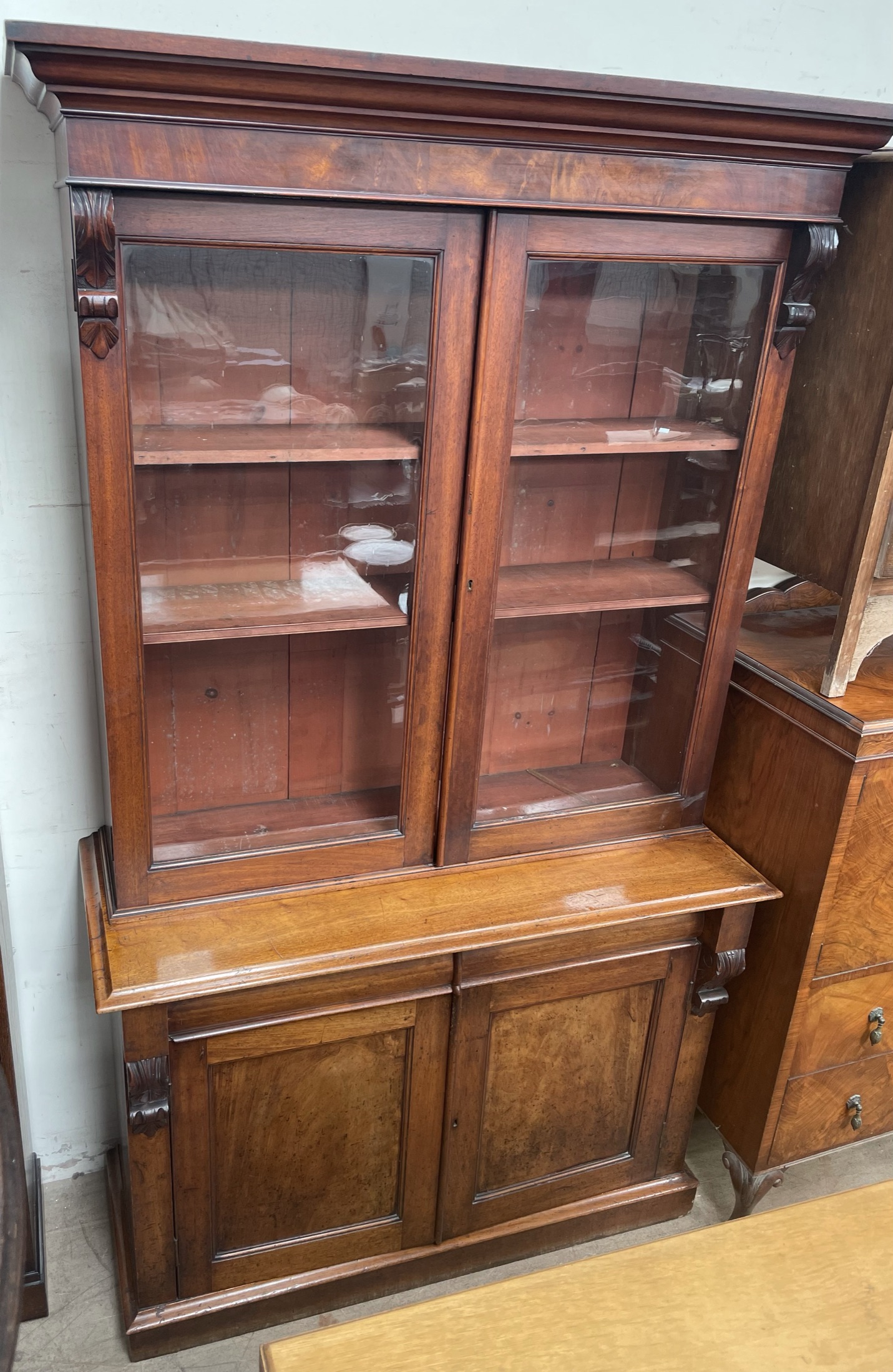 A Victorian mahogany bookcase, with a moulded cornice above a pair of glazed doors,