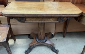 A Victorian rosewood tea table,