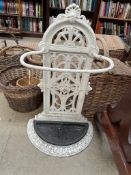 A white painted cast iron stick / umbrella stand