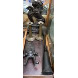 A cast iron Lion Rampart door stop together with a cast iron beetle boot jack,
