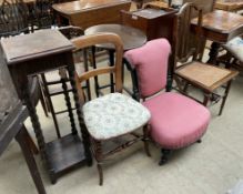 A Victorian ebonised nursing chair together with two bedroom chairs and an oak jardiniere stand