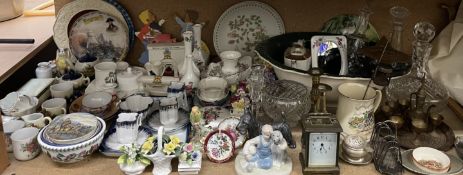 A brass carriage clock together with brass candlesticks, glass decanters, wash basin, crested wares,