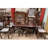A modern oak drop leaf dining table together with a set of five bar back dining chairs and two fire