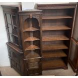A 20th century oak bookcase together with two oak corner cupboards