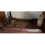 A Didgeridoo, together with carved figures,