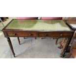 A Victorian mahogany desk with a leather inset top above two drawers on turned tapering legs,