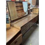 A teak wardrobe together with a teak dressing table