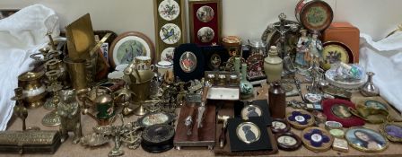 A pair of silhouettes together with assorted decorative miniatures, brass wares, tins, crucifixes,