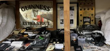 Guinness memorabilia including shirts, slippers, Zippo lighter, advertising mirror, cufflinks,