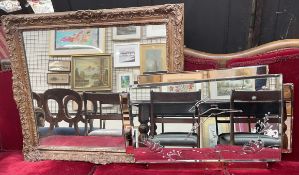 A wall mirror with leaping deer decoration together with a gilt framed wall mirror