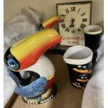 A Guinness Toucan Clock, G0051 together with a Heritage Toucan Money Box,