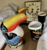 A Guinness Toucan Clock, G0051 together with a Heritage Toucan Money Box,