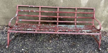 A slatted metal garden bench