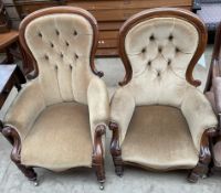 A matched pair of Victorian mahogany framed spoon back chairs, with turned legs and castors,