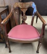 An Edwardian rosewood elbow chair with inlaid decoration of flowers and leaves on shaped square
