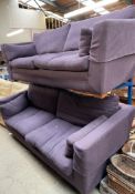 A pair of large purple upholstered settees