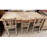 A pine scrub top table together with six assorted chairs