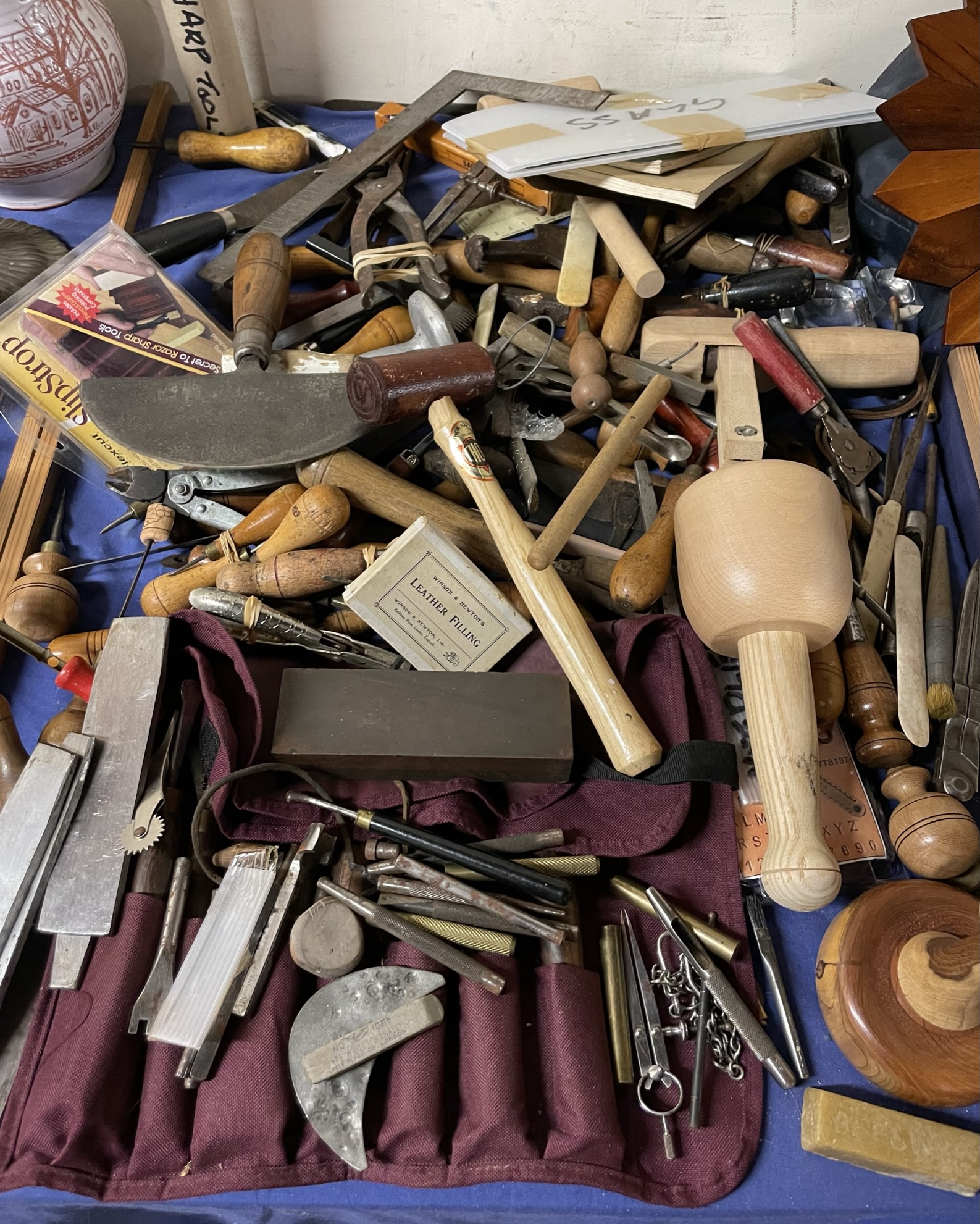 A collection of leather working and other tools etc