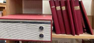 A Marconiphone record player together with Cue World magazines