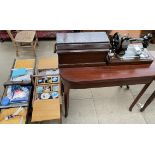 A Singer sewing machine together with two sewing boxes and contents