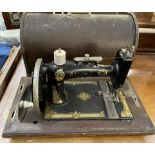 An Atlas D sewing machine in a case