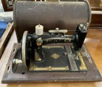 An Atlas D sewing machine in a case