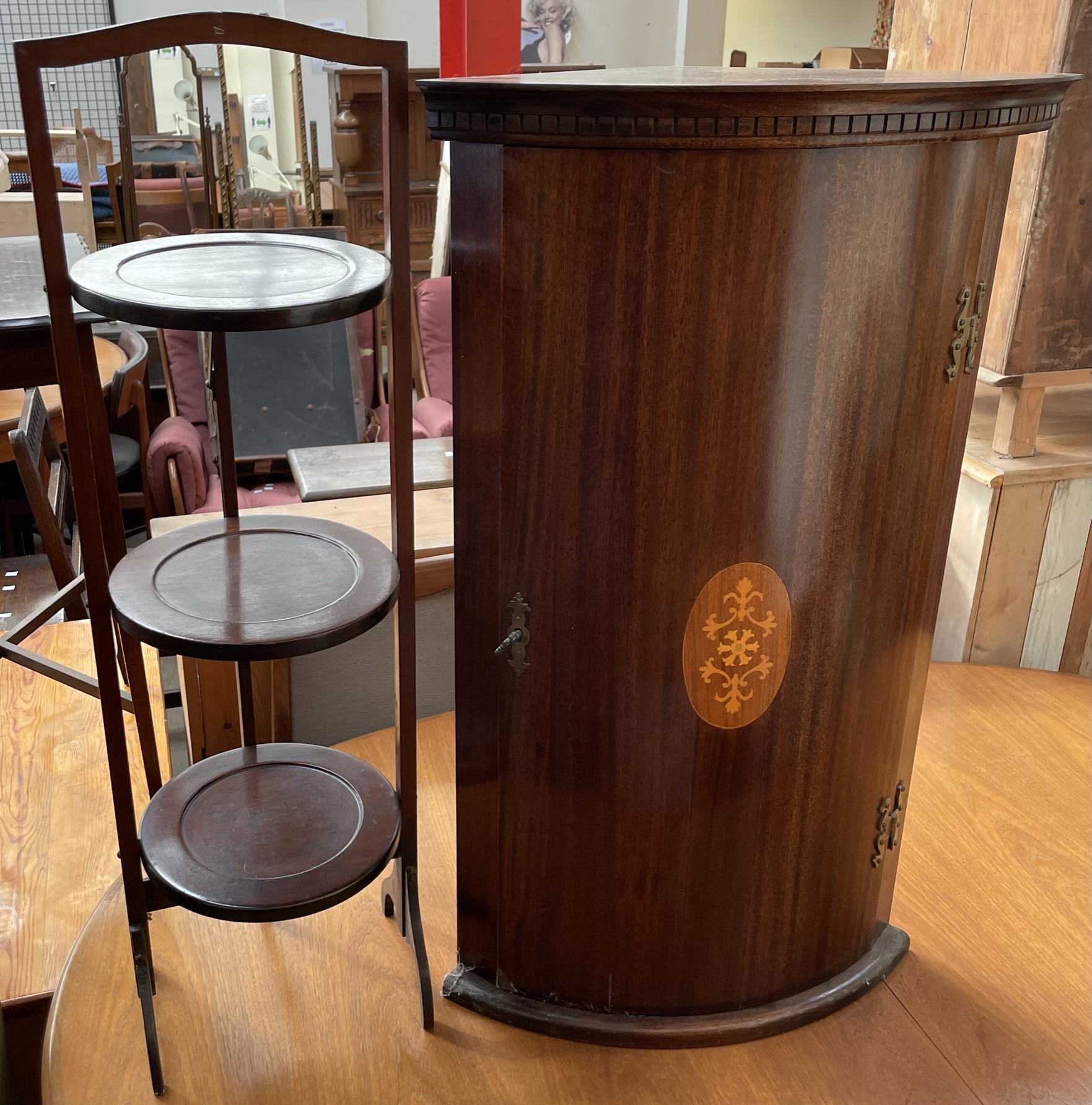 A mahogany three tier folding cake stand,