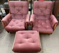 A pair of mid 20th century G-Plan teak and upholstered armchairs with matching footstool