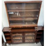 A 20th century mahogany display cabinet, with central glazed doors,