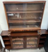 A 20th century mahogany display cabinet, with central glazed doors,
