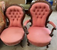 A Victorian walnut gentleman's chair with carved decoration and button back upholstery together