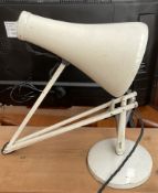 A white painted anglepoise lamp