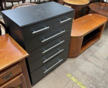 A black ash chest of drawers together with a walnut television stand