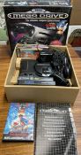 A Sega Mega drive and games, boxed (Sold as seen,