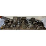 A large quantity of electroplated wares including tureens and covers, ice buckets, part tea sets,