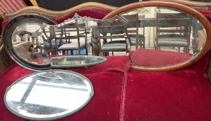 A Edwardian mahogany wall mirror together with three other mirrors