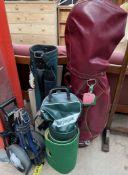 Two golf bags together with a golf trolley a ball bag, putting green,