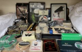 Guinness memorabilia including a lap tray, pictures, folder, coasters, beer mats,