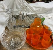 An Orange glass lemonade set together with glass decanters,